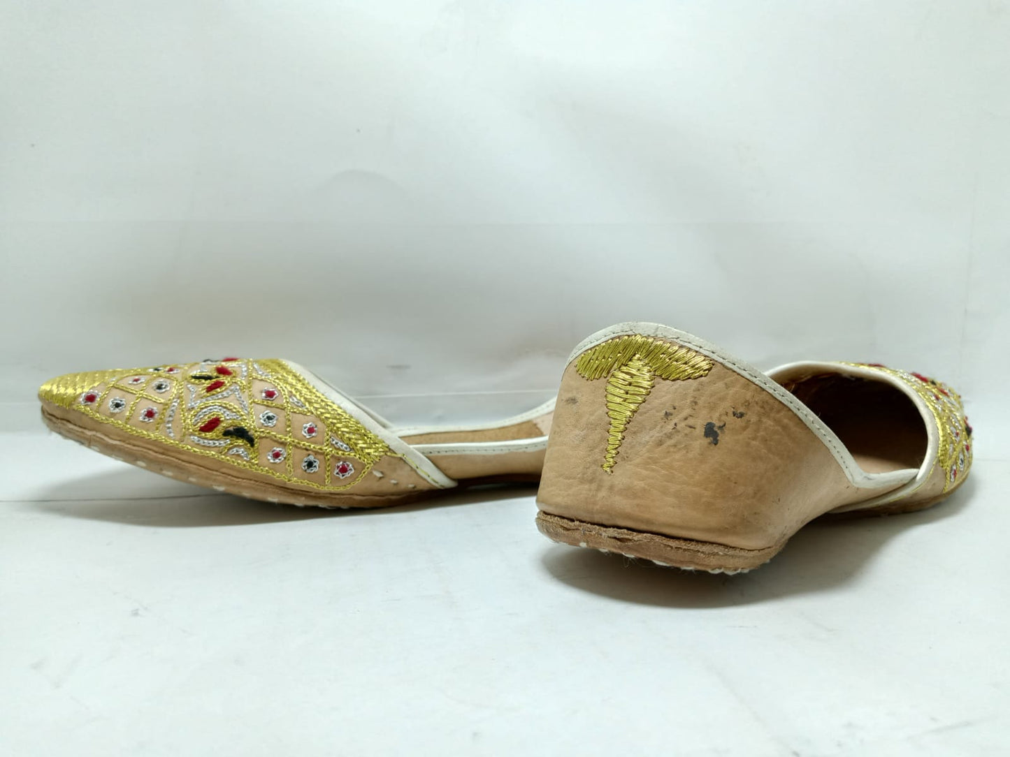 Jeniius "Golden jutti" Embroidered Khussa | Handcrafted Elegance with Gold, Red & Black Accents