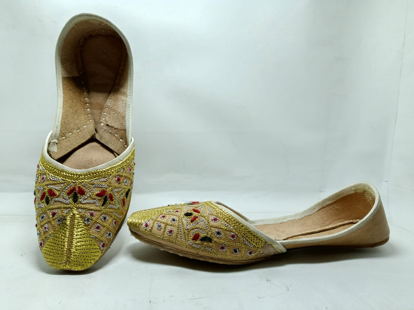 Jeniius "Golden jutti" Embroidered Khussa | Handcrafted Elegance with Gold, Red & Black Accents